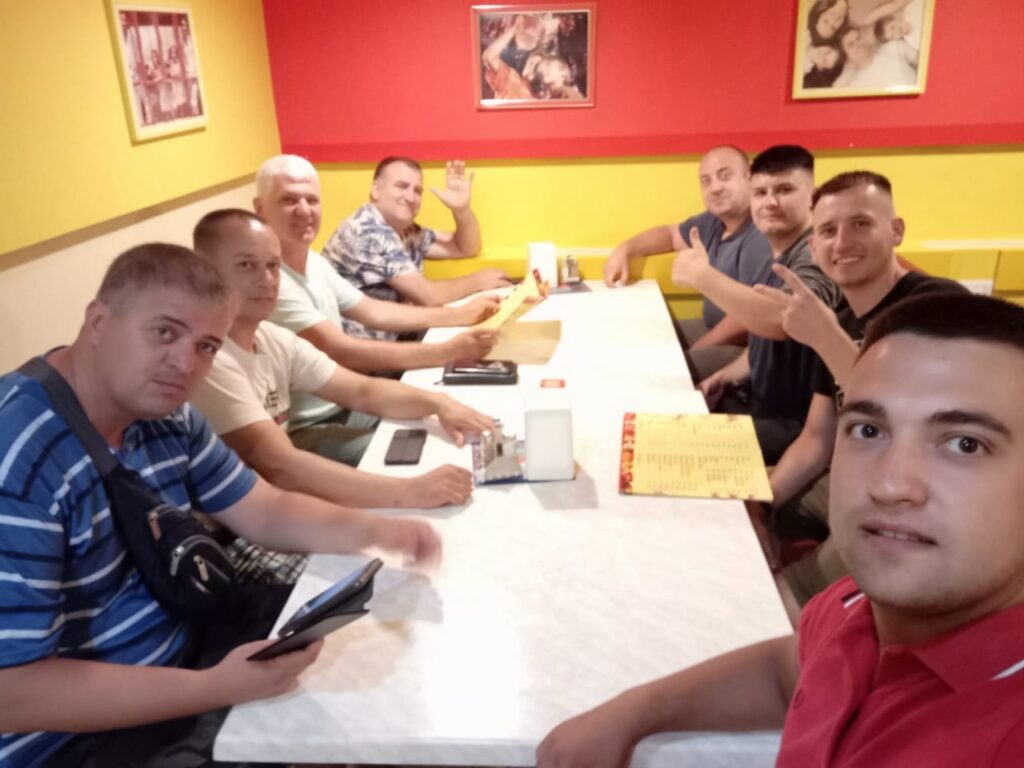 Slavic and a team from Kharkov Oblast, Ukraine, have a meal after helping refugees in the area, September 2022